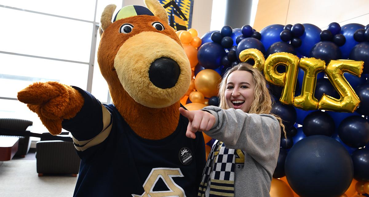 Zippy and a UA student pointing